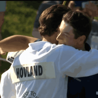 Two Men Hugging With One Wearing A Shirt That Says Hovland On The Back GIF