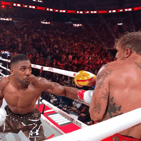 Two Men In A Boxing Ring With A Sign That Says Celsius On It GIF