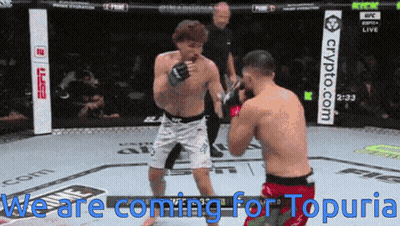 Two Men In A Boxing Ring With The Words We Are Coming For Topuria Above Them GIF
