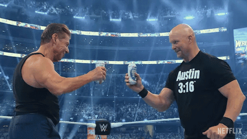 Two Men In A Wrestling Ring One Wearing A Austin 3:16 Shirt GIF