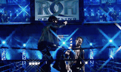 Two Men In A Wrestling Ring With A Sign That Says ' Roh Wrestling ' GIF