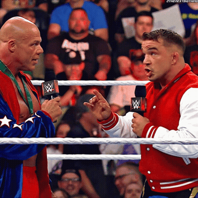 Two Men In A Wrestling Ring With One Wearing A Red Jacket That Says The Next Thing GIF