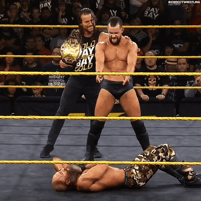 Two Men In A Wrestling Ring With One Wearing A Shirt That Says Jay Gold On It GIF