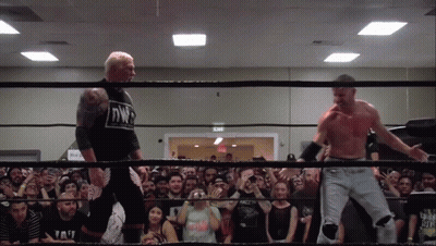 Two Men In A Wrestling Ring With One Wearing A Shirt That Says Nwp On It GIF
