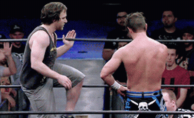 Two Men In A Wrestling Ring With One Wearing Shorts With A Skull And Crossbones On Them GIF