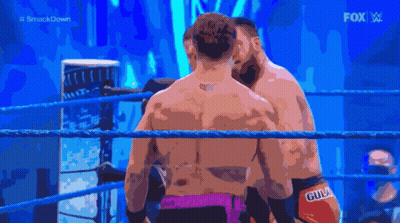 Two Men In A Wrestling Ring With The Fox Logo In The Background GIF