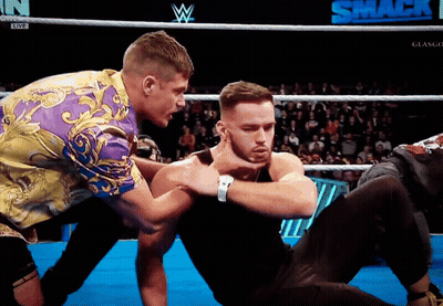 Two Men In A Wrestling Ring With The Word Smack On The Bottom Right GIF