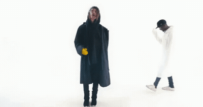 Two Men In Black And White Coats GIF