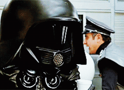 Two Men In Black Helmets GIF