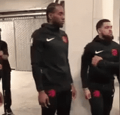 Two Men In Black Nike Jackets GIF