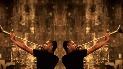 Two Men In Black Shirts Are Playing Trumpets In Front Of A Brown Wall GIF