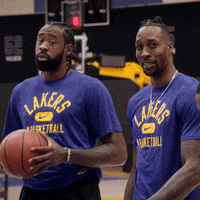 Two Men In Blue Lakers Shirts Holding Basketballs GIF