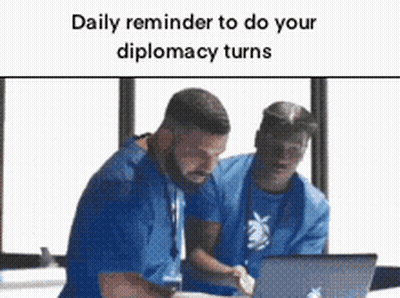 Two Men In Blue Scrubs Looking At Laptop GIF