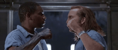 Two Men In Blue Shirts Talking GIF