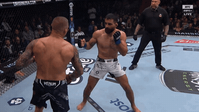 Two Men In Boxing Ring One In Venum Shorts GIF