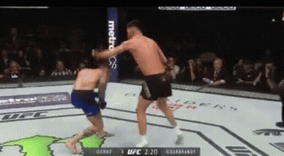 Two Men In Boxing Ring With Metropcs Banner GIF
