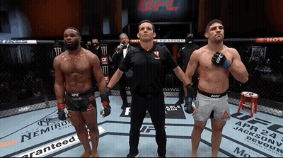 Two Men In Boxing Ring With Referee GIF