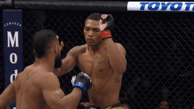Two Men In Boxing Ring With Toyot Banner GIF