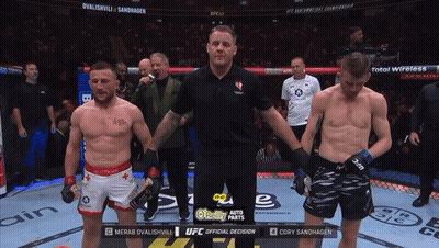 Two Men In Boxing Ring With UFC Official Decision GIF
