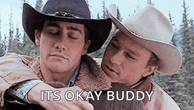 Two Men In Cowboy Hats Are Hugging Each Other And The Words `` It 'S Okay Buddy '' Are Above Them . GIF