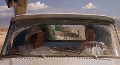Two Men In Cowboy Hats Driving White Truck GIF