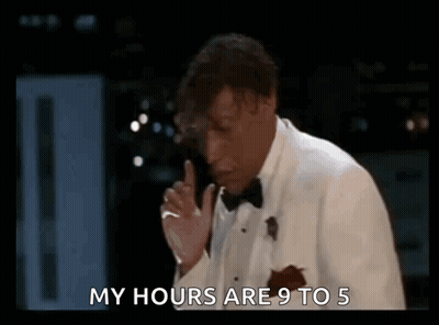 Two Men In Dark Room One Holding Microphone GIF