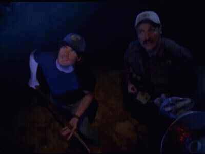 Two Men In Dark Room One Wearing Hat With 92 GIF