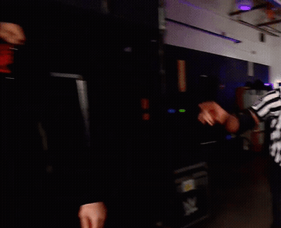 Two Men In Dark Room One With K Tattoo GIF