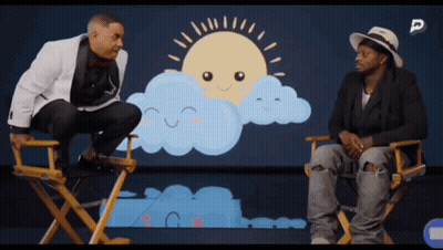 Two Men In Directors Chairs In Front Of Sun And Clouds GIF