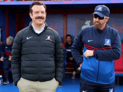 Two Men In Dugout One With Nike Hat GIF