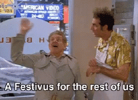 Two Men In Front Of A Sign That Says American Video GIF