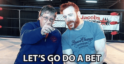 Two Men In Front Of A Sign That Says Jacobs On It GIF
