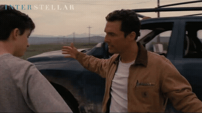Two Men In Front Of Car With Interstellar GIF