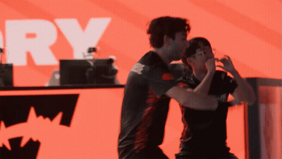 Two Men In Front Of Red Background With Word Ry GIF