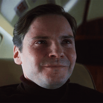 Two Men In Front Of Stained Glass Window In Living Room GIF