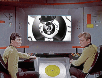 Two Men In Front Of Televandalist Screen GIF
