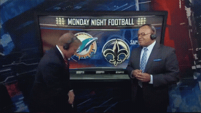 Two Men In Front Of TV Showing Monday Night Football GIF