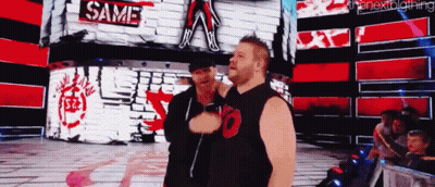 Two Men In Front Of Wall Saying Same GIF