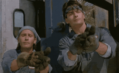 Two Men In Gloves Making Peace Sign GIF