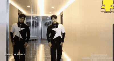 Two Men In Hallway Behind The Scenes GIF