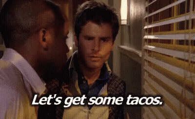Two Men In Hallway Saying Let's Get Some Tacos GIF