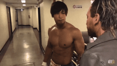 Two Men In Hallway With No Smoking Sign GIF