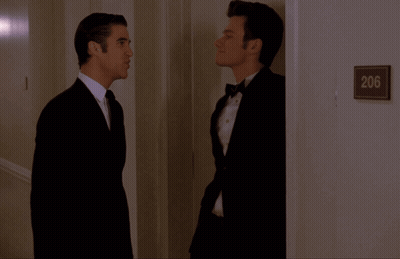 Two Men In Hallway With Sign 206 GIF