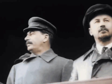 Two Men In Hats And Coats GIF