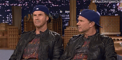 Two Men In Hats And Leather Jackets On Couch GIF