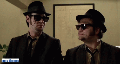 Two Men In Hats And Sunglasses Blues Brothers Sign GIF