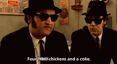 Two Men In Hats And Sunglasses Talking About Chickens And Coke GIF