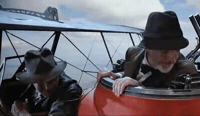 Two Men In Hats Sitting In Plane GIF