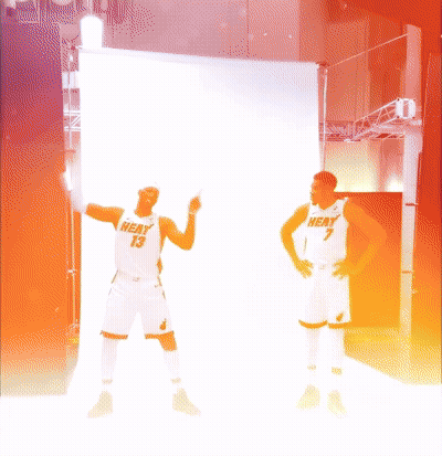 Two Men In Heat Jerseys Standing Together GIF