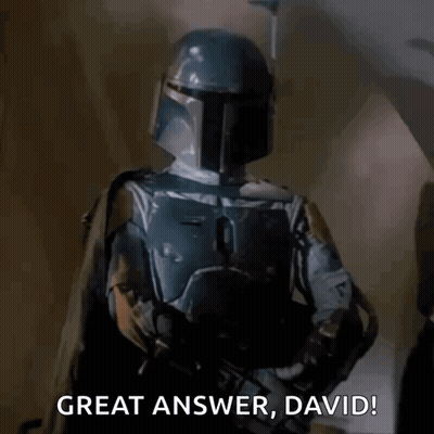Two Men In Helmets Holding Guns GIF
